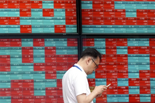 Stock market today: Asian shares decline after a mixed post-holiday session on Wall Street