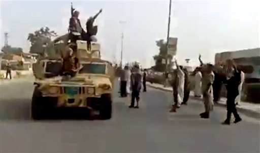 Militants fly their black flags over Iraq refinery