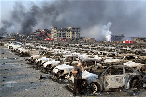 Firefighter rescued from blast zone in China's Tianjin port