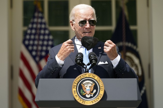 Emerging from isolation, Biden urges Americans to get shots
