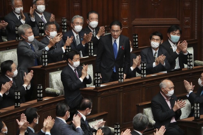 Japan's Parliament elects former diplomat Kishida as new PM