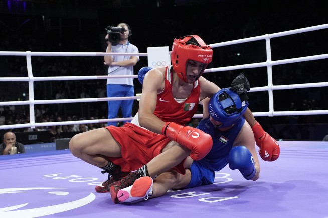 Algerian boxer Imane Khelif clinches medal at Olympics after outcry fueled by gender misconceptions