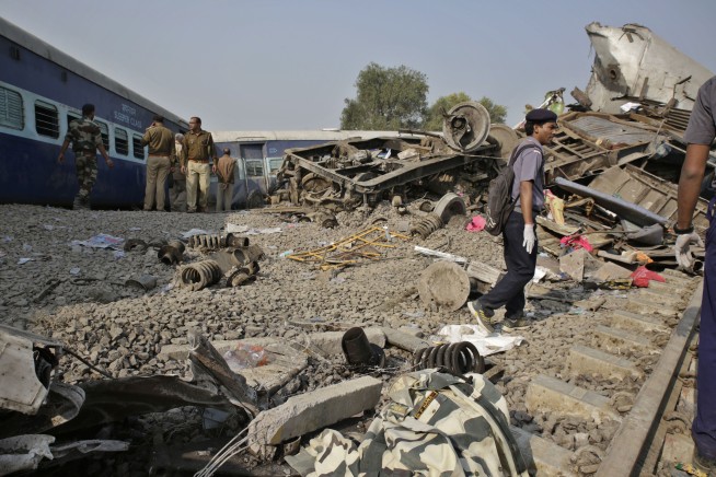 Train derails in north India, killing 104; many trapped