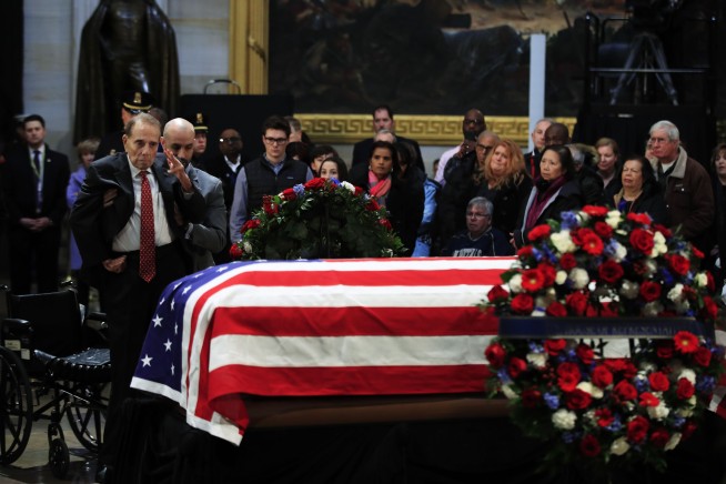 The Latest: Trumps visiting with family of George H.W. Bush