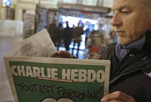 As Charlie Hebdo fronting Muhammad sells out, comic detained