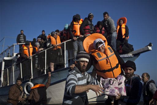 The Latest: Merkel: 'Fairer distribution' of refugees needed