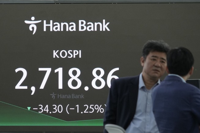 Stock market today: Asian shares drop after Wall Street sinks on rate worries