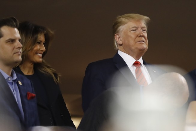 The Latest: Nats Park fans boo Trump, chant 'Lock him up!'