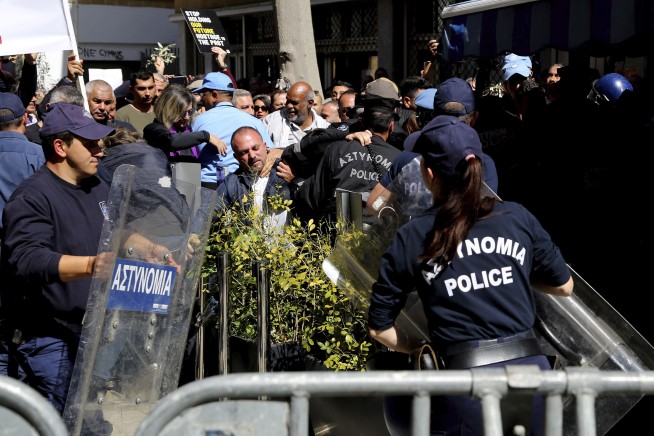 Cyprus police pepper spray protesters at shut crossing point