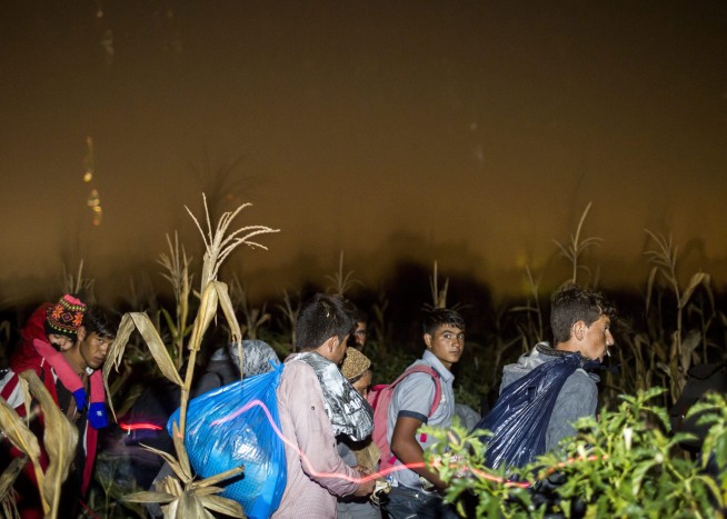 The Latest: 10 migrants drown at sea off Greece