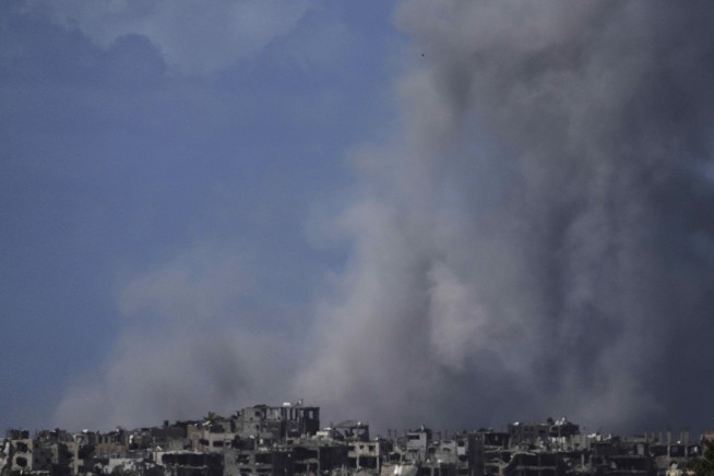 Israeli troops advance in Gaza to retake part of a corridor dividing north from south