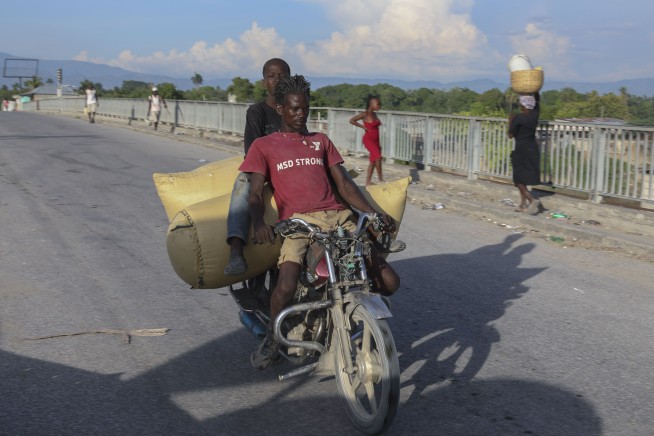Another town in Haiti comes under attack a week after gangs killed at least 115 people
