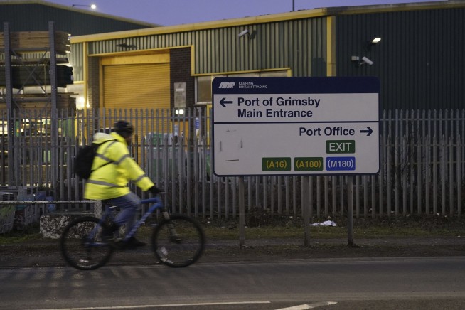 A cargo ship hits a tanker and they catch fire off England, with one crew member missing