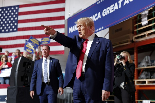Trump goes to Michigan to rail against Biden's electric vehicle push while GOP rivals debate
