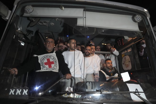 Hamas hands over bodies of 4 hostages to Israel as dozens of Palestinians leave Israeli prison