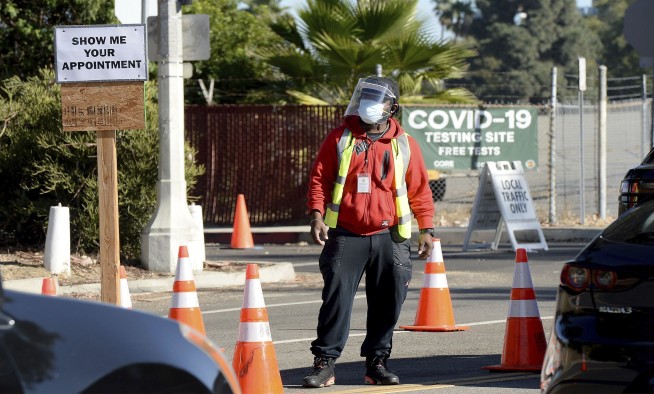 Los Angeles readies plan for curfew as virus cases spike
