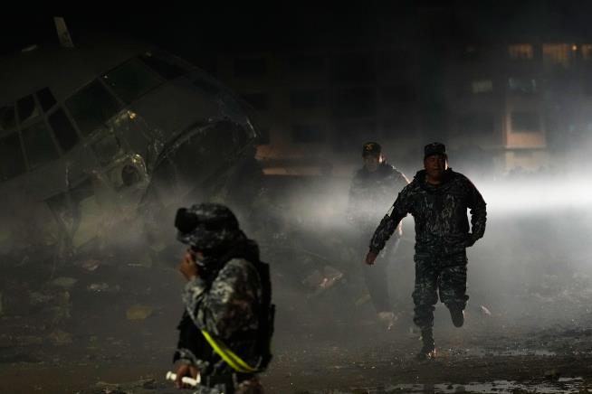 Cargo plane carrying money crashes near Bolivia's capital, killing at least 15 people, official says