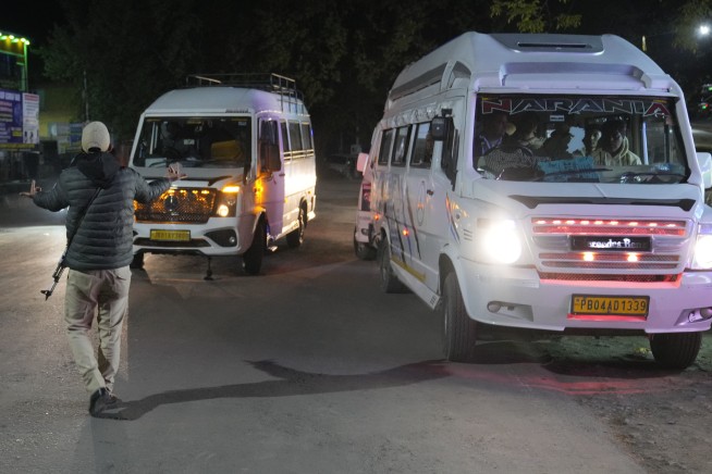 Militants kill at least 26 tourists at a resort in Indian-controlled Kashmir