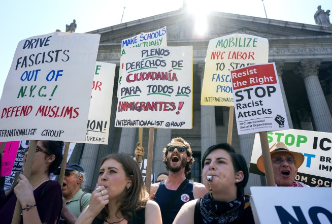 The Latest: Arrests made at anti-Shariah rally in Seattle