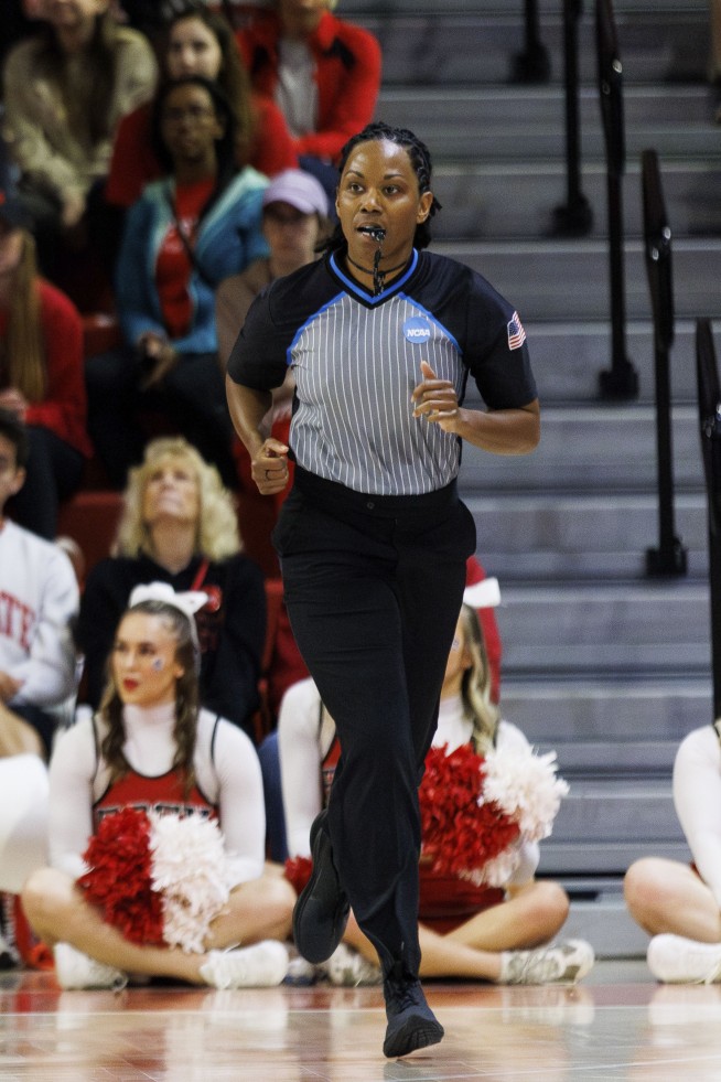 NCAA removes game official at halftime because of background conflict