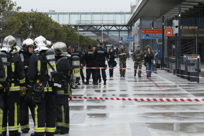The Latest: France: Orly attacker held gun to soldier's head
