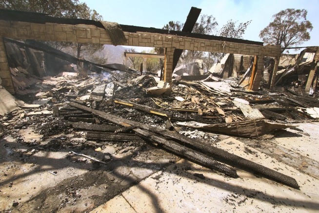 New life, new destruction for Southern California wildfire