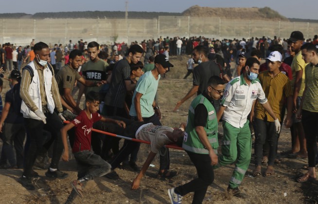 Gaza border clashes wound 24 Palestinians, Israeli policeman