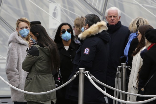 Virus spreads to over 60 countries; France closes the Louvre