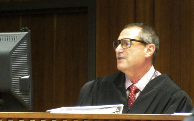 Trial starts for woman charged with killing her twin