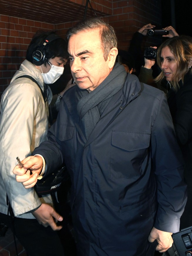 The Latest: Tokyo detention center confirms Ghosn is inside