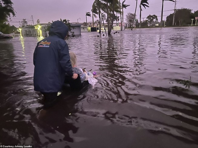 Son's images show him rescuing Mom from Ian's floodwaters