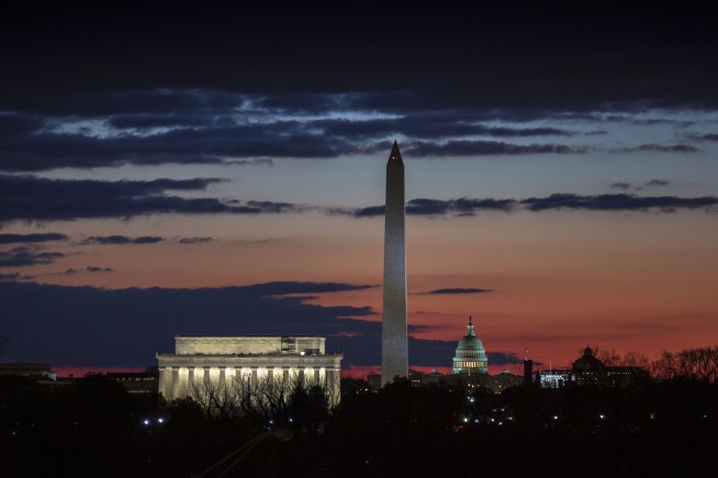 The Latest: Trump says he might skip forum amid shutdown