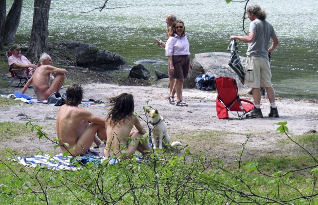 Vermont nude beach fans against parking lot, boardwalk