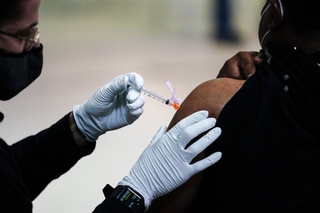 Many still hesitate to get vaccine, but reluctance is easing