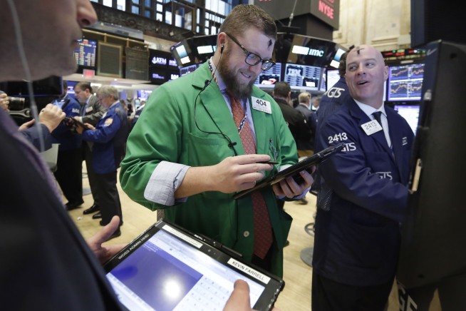 US stocks surge in early trading; Dow crosses 21,000 points