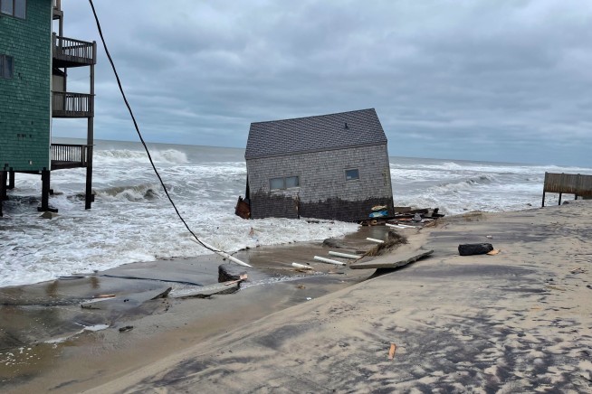 Another beachfront stilt house collapses into the surf on the Outer Banks