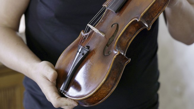 A secret note hidden in Dachau-built ‘Violin of Hope’ tells a tale of survival and craftsmanship