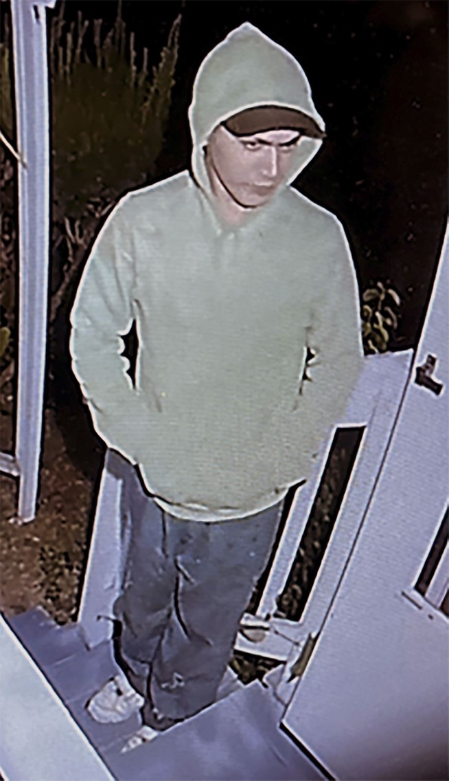 Escaped murderer still at large slips out of search area, steals van, tries to contact ex-co-workers