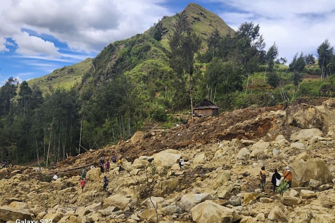 Papua New Guinea says Friday's landslide buried more than 2,000 people and formally asks for help