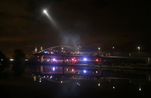 Protesters block highway, stop train in California