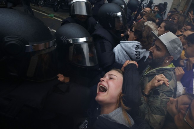 Catalans stop work to protest police force during referendum