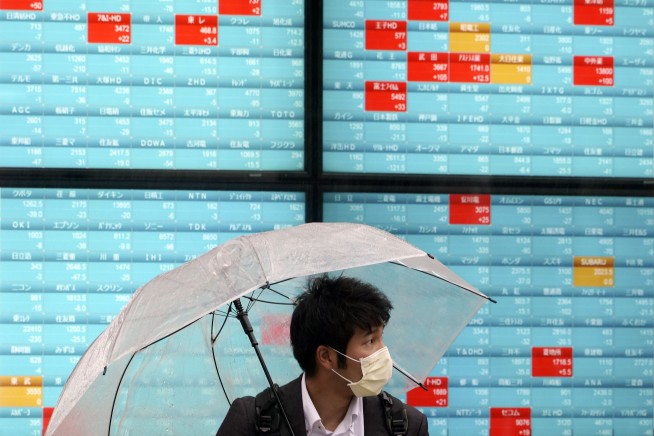 Stocks end higher as traders hope restrictions will ease