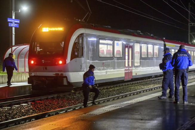 Iranian man wielding an axe and knife is killed by police after seizing hostages on Swiss train