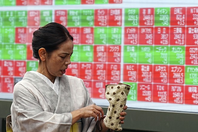 Stock market today: Asian stocks are mixed after Dow sets a new record