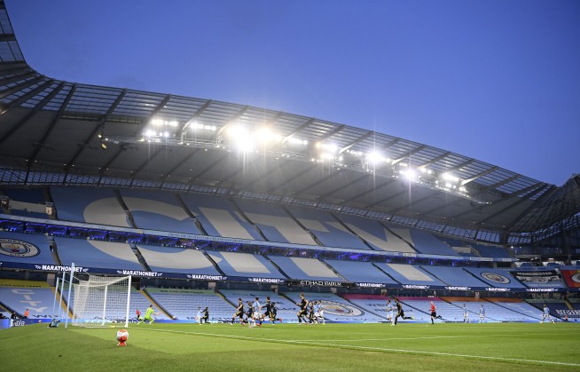 After 100-day wait, English soccer returns and takes a knee