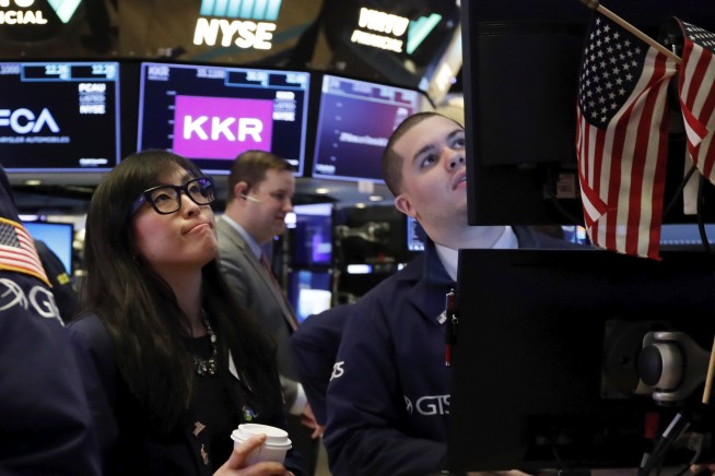 Stocks sink, bonds soar on fears virus will stunt economy