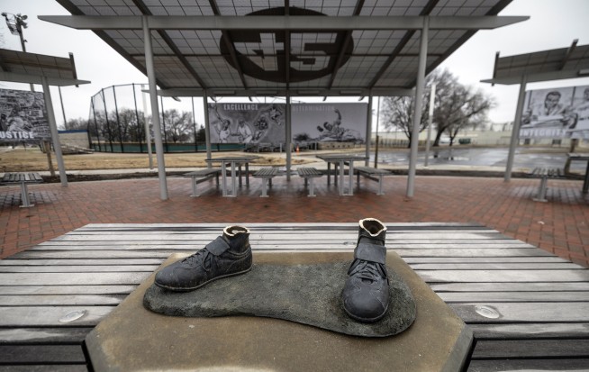 An arrest has been made in the theft of a Jackie Robinson statue later found dismantled and burned