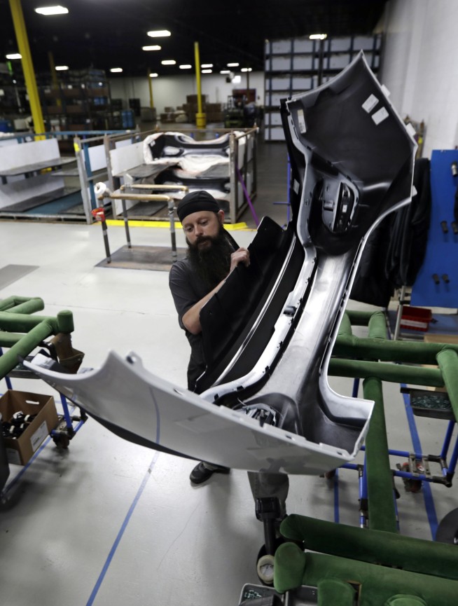 In GM country, workers aren't abandoning Trump - so far