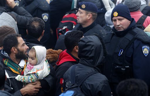 The Latest: Hungary's Orban: Stop migrants from coming in