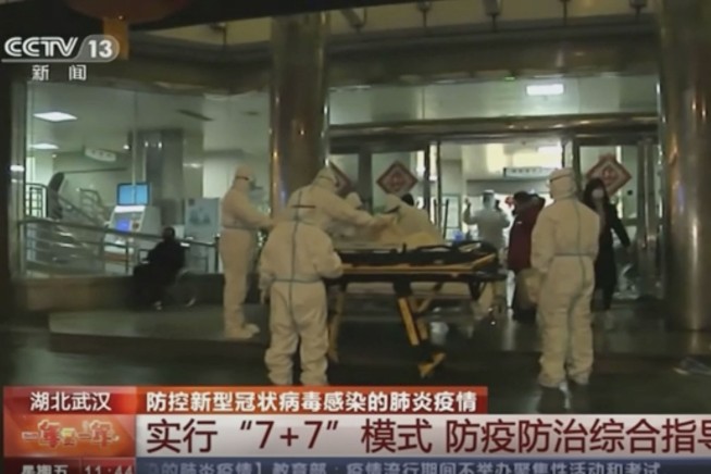 China building a hospital to treat virus, expands lockdowns